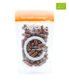 Clearly organic Chaga capsules in a bottle, showing the dietary supplement packaging with capsules inside.